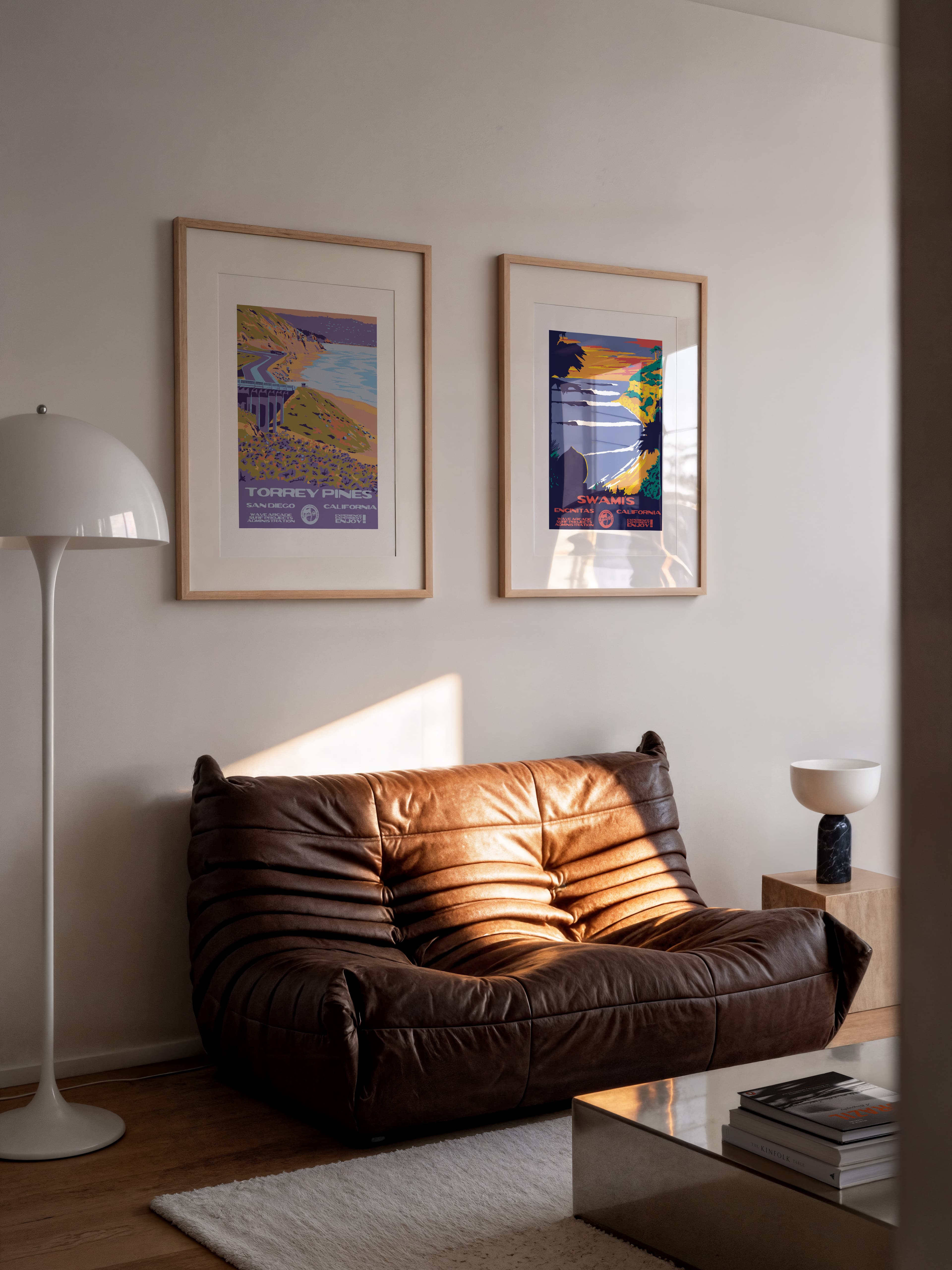 Two Wave Arcade prints hung above a couch